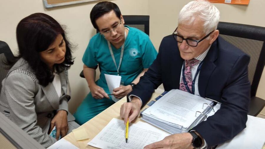 Laboratory team collaborating in an accredited lab